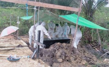 Sinergitas TNI dan Polisi Bantu Pemakaman Jenazah Terkonfirmasi Covid-19